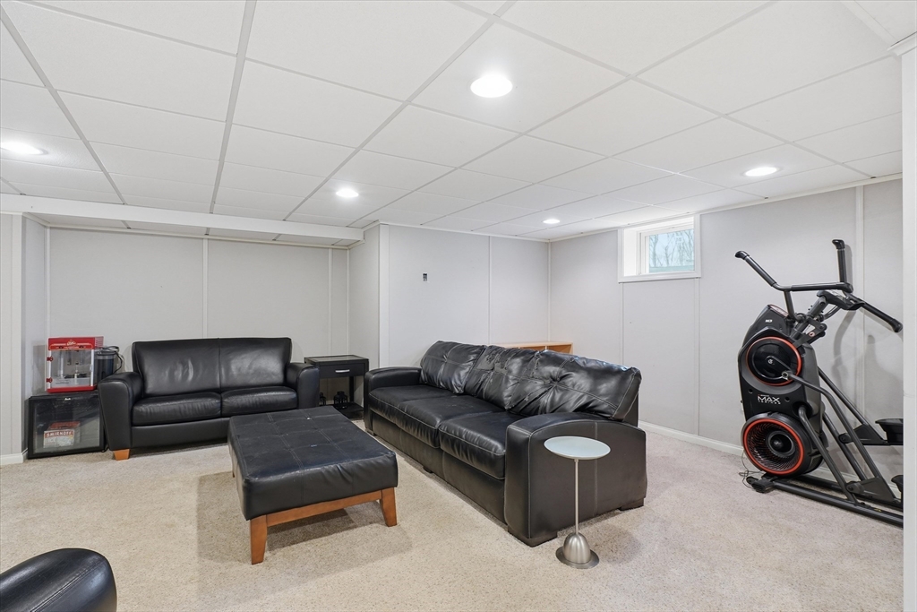 9 Pinewood Avenue Beverly, MA 01915 - Photo 30 of 41 a living room with furniture a couch and a washing machine