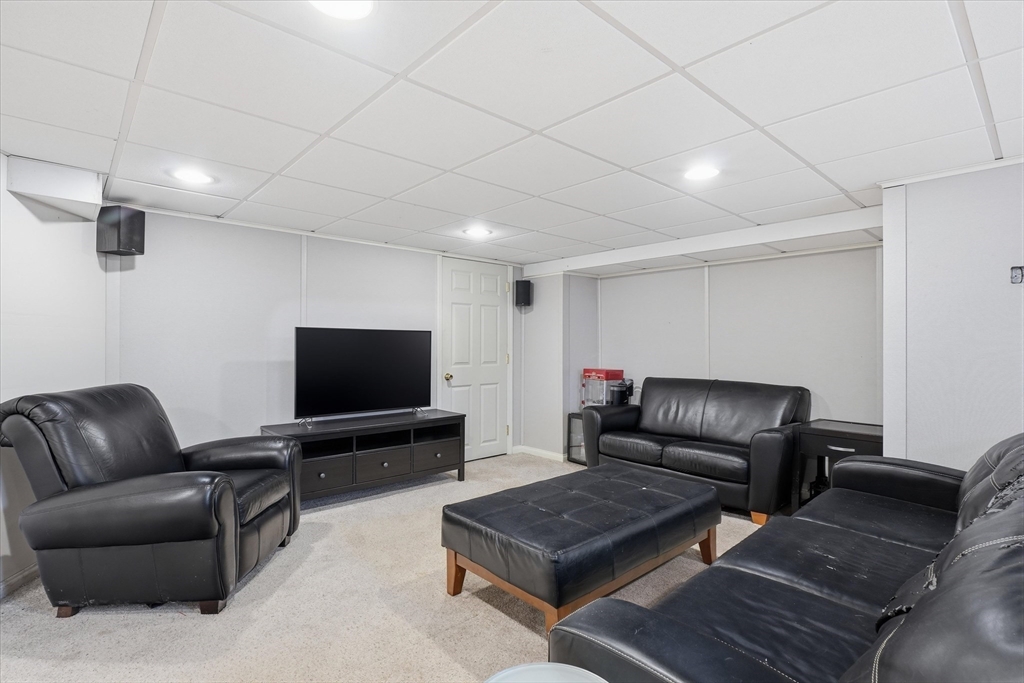 9 Pinewood Avenue Beverly, MA 01915 - Photo 31 of 41 a living room with furniture and a flat screen tv