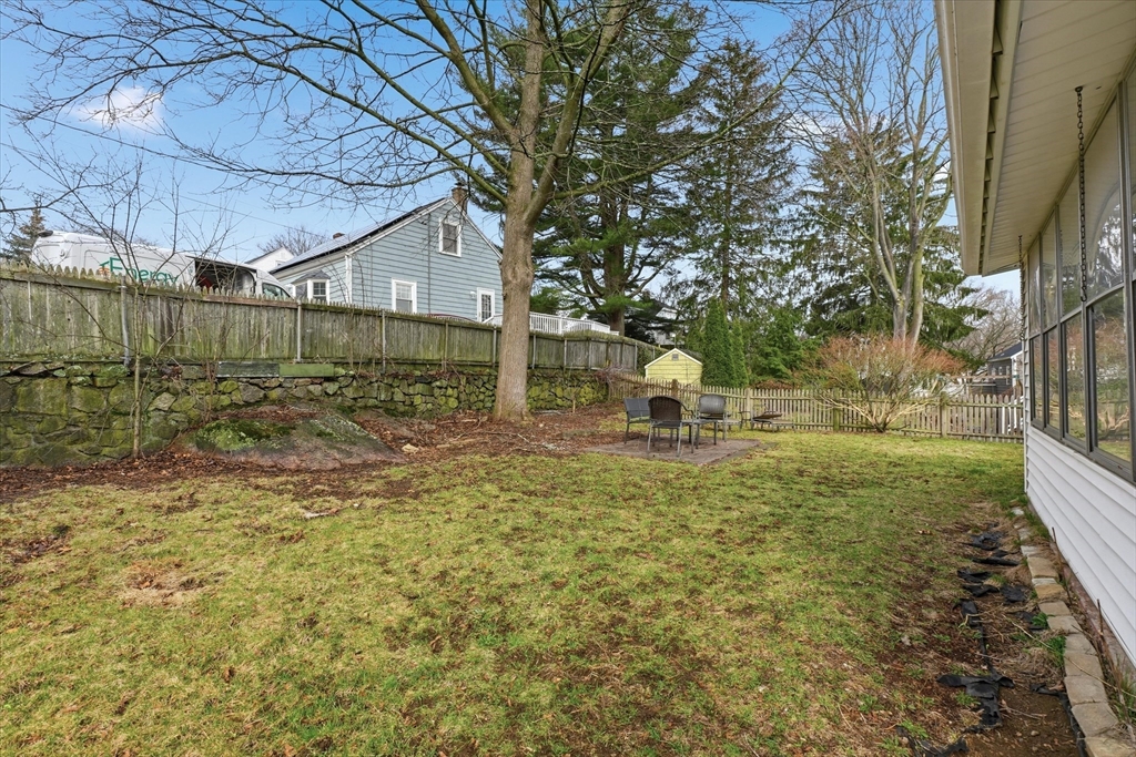 9 Pinewood Avenue Beverly, MA 01915 - Photo 32 of 41 a view of a backyard with a tree
