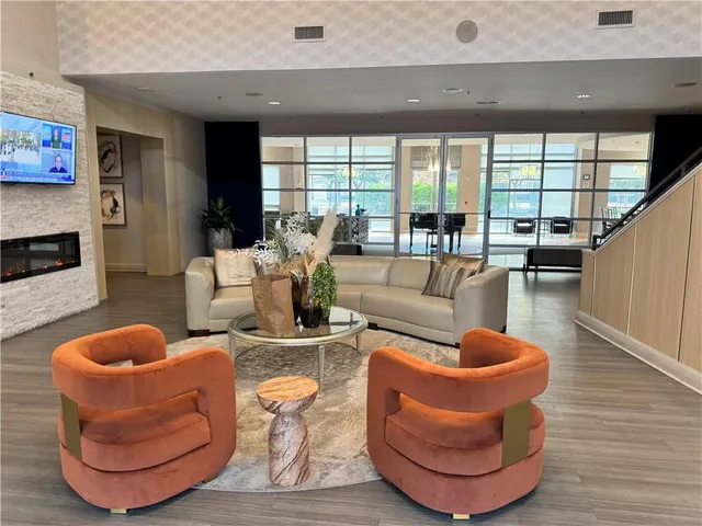 a living room with furniture and a large window