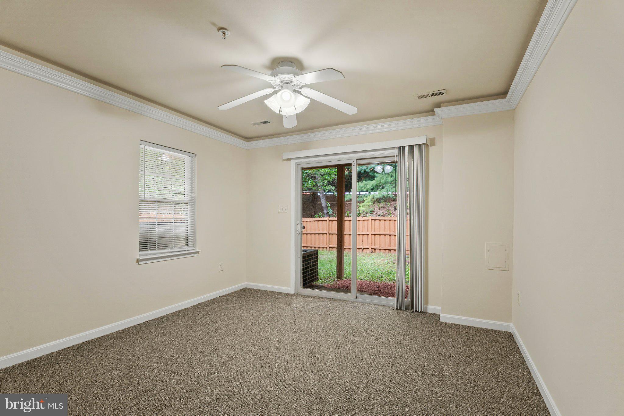 1709 Woodruff Way Frederick, MD 21701 - Photo 21 of 42 an empty room with windows and fan