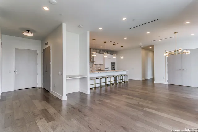 a view of an empty room with glass door