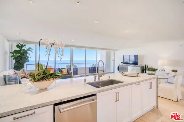 a kitchen with sink and cabinets