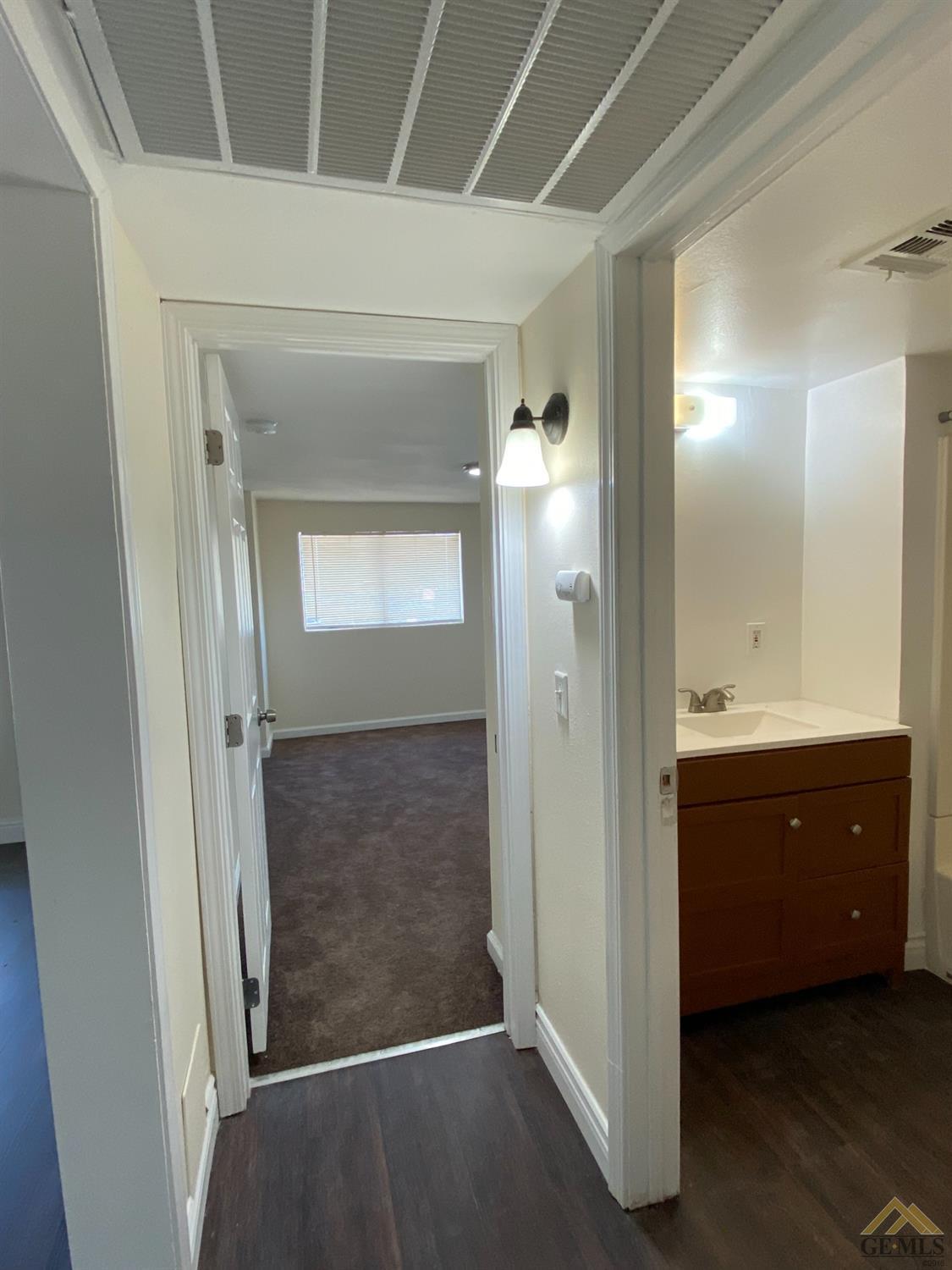 Undisclosed Address Taft, CA 93268 - Photo 19 of 22 an empty room with mirror and a sink