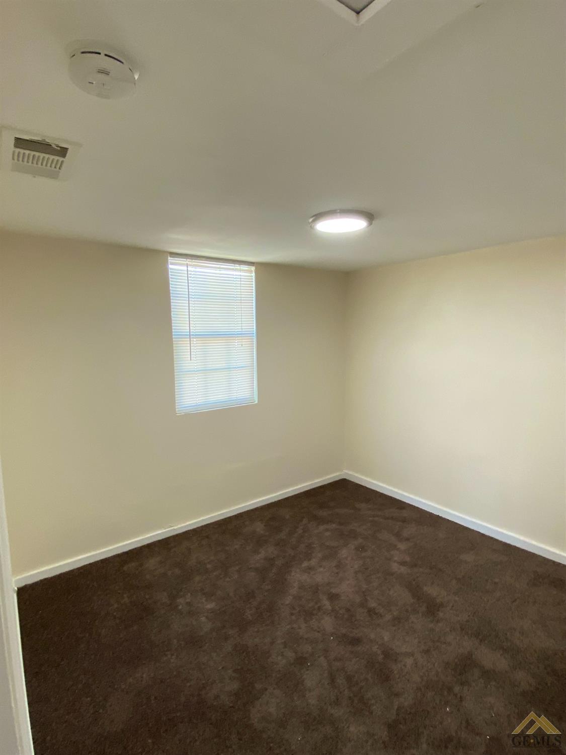 Undisclosed Address Taft, CA 93268 - Photo 7 of 22 an empty room with a window