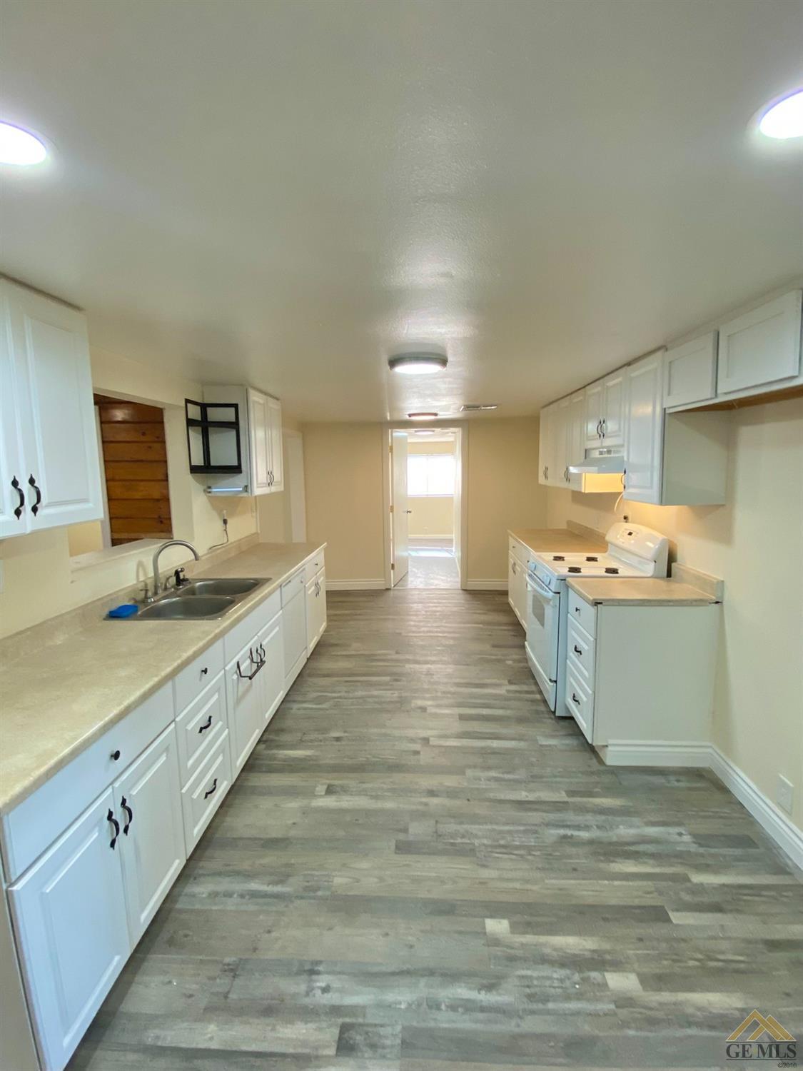 Undisclosed Address Taft, CA 93268 - Photo 9 of 22 a large bathroom with a sink mirror and a bath tub