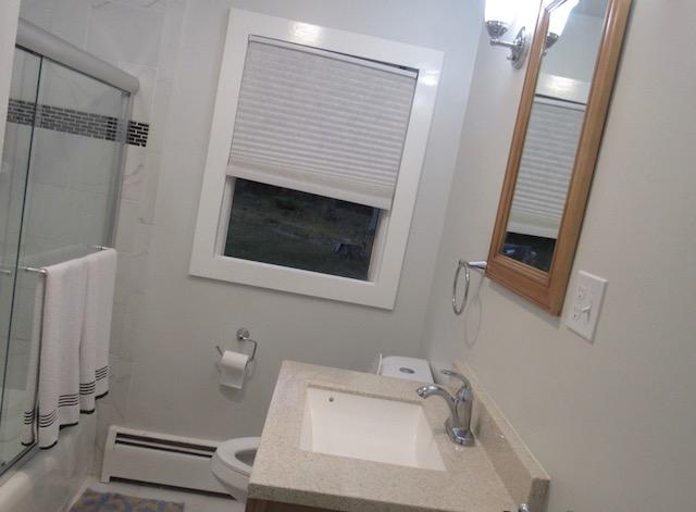 993 Shootflying Hill Road Centerville, MA 02632 - Photo 8 of 21 a bathroom with a sink and a mirror