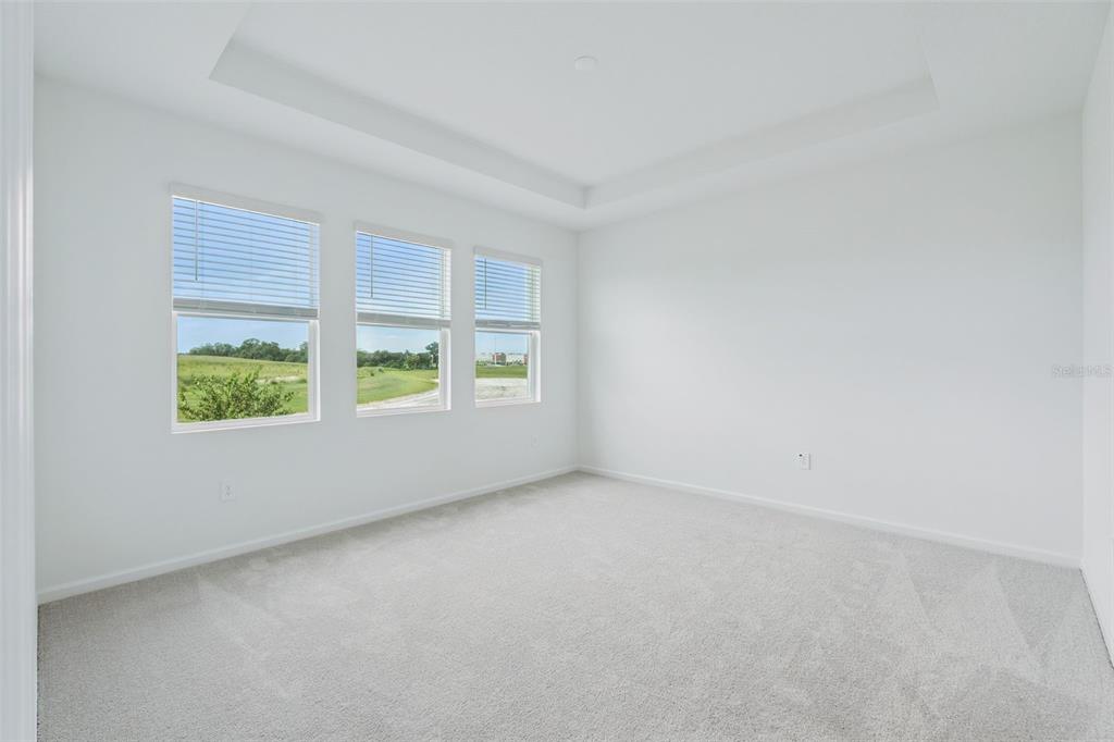 1672 Rider Rain Lane Apopka, FL 32703 - Photo 19 of 35 an empty room with windows