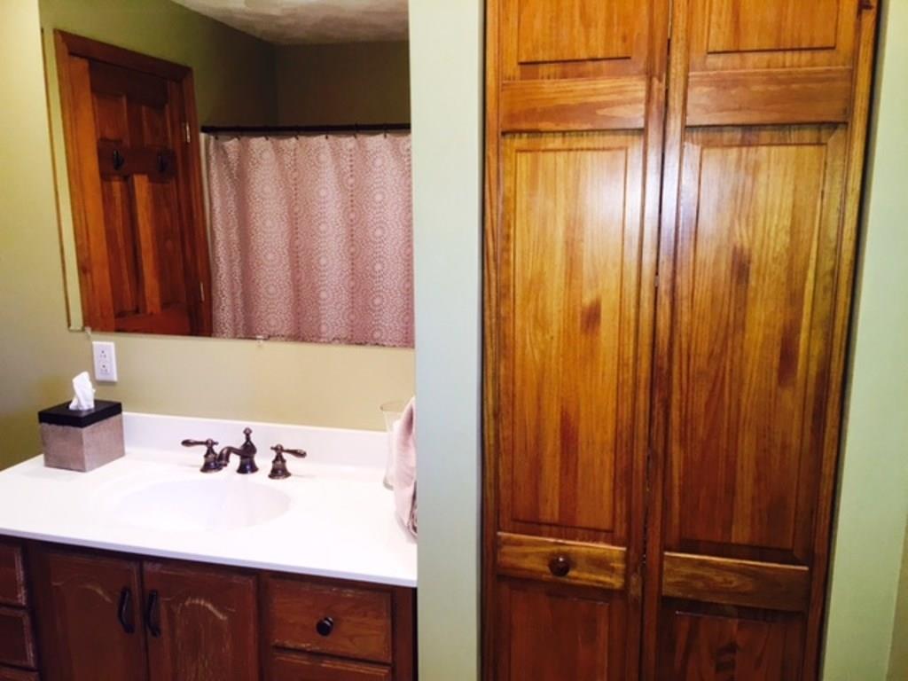619 Sandy Hill Road Manor, PA 15642 - Photo 14 of 25 The main bathroom features a spacious vanity and large linen closet. In the hall is a second linen closet.