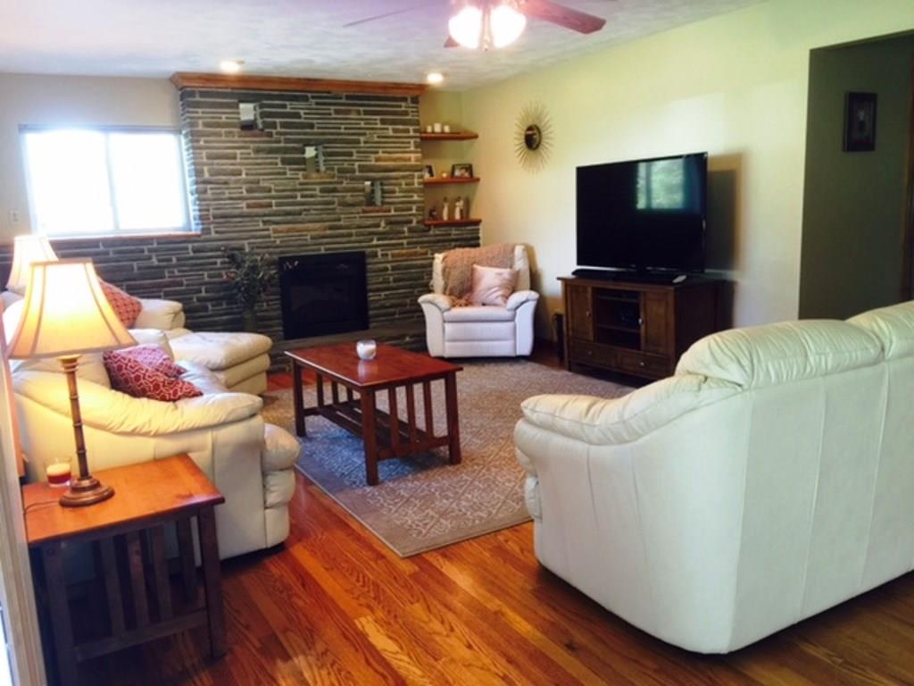 619 Sandy Hill Road Manor, PA 15642 - Photo 3 of 25 The warm hardwood floors greet you as you enter into the spacious living room area.