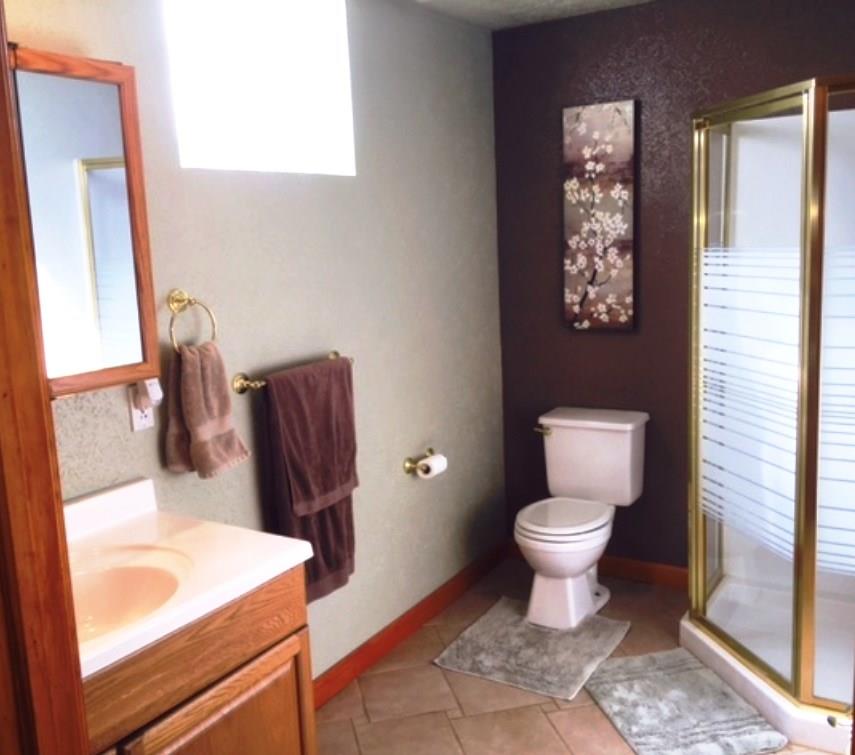 619 Sandy Hill Road Manor, PA 15642 - Photo 22 of 25 Quality choices and colors in the spacious lower level bathroom conveniently located off of the bar area.