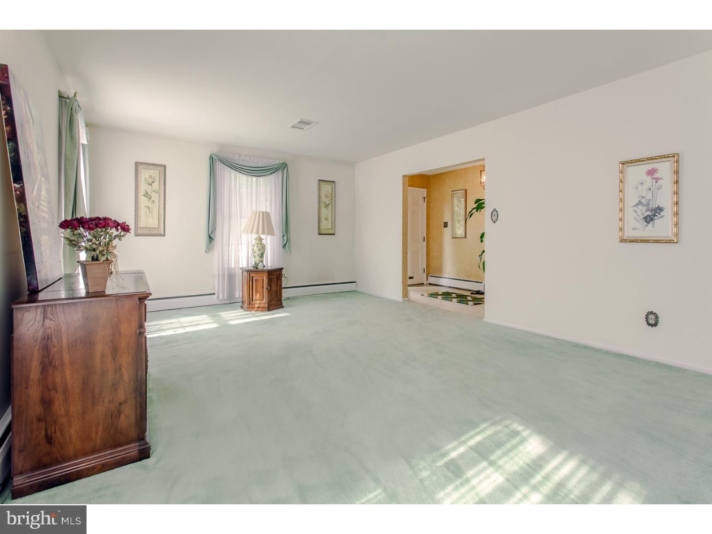 743 West Rolling Road Springfield, PA 19064 - Photo 6 of 19 a view of a room with cabinet mirror and a bathtub