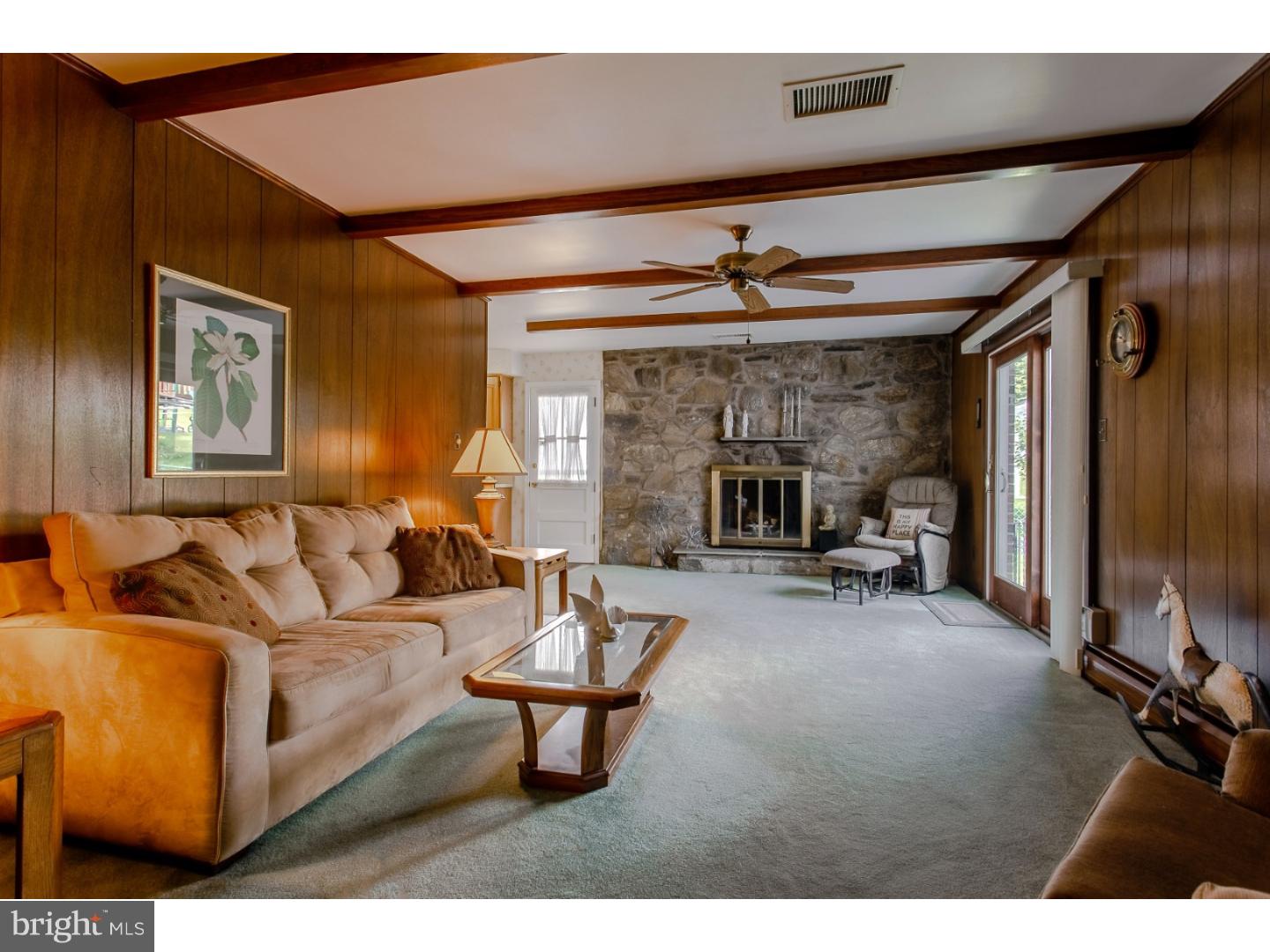 743 West Rolling Road Springfield, PA 19064 - Photo 7 of 19 a living room with furniture and a flat screen tv