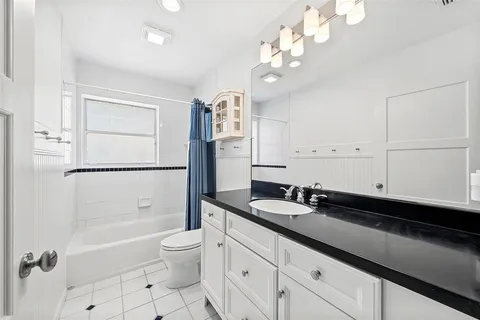 a bedroom with bed and window