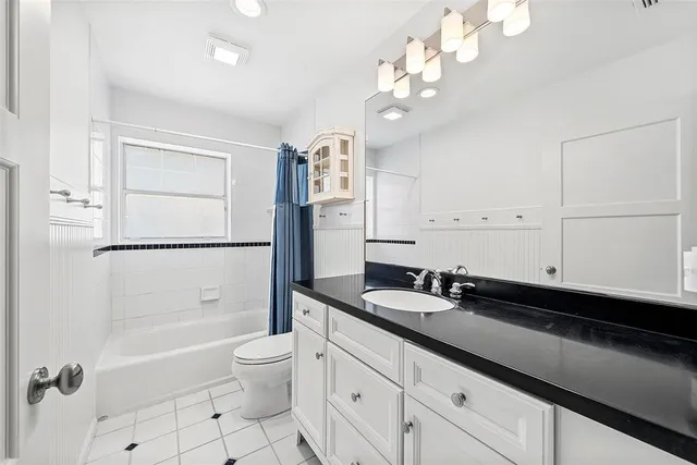 a bedroom with bed and window