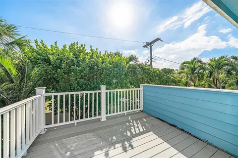 an aerial view of a house with a swimming pool yard and outdoor seating