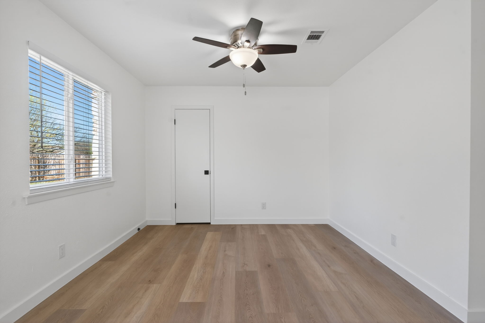 8400 Seminary Ridge Drive Austin, TX 78745 - Photo 15 of 37 Unfurnished room featuring ceiling fan and light wood-type flooring