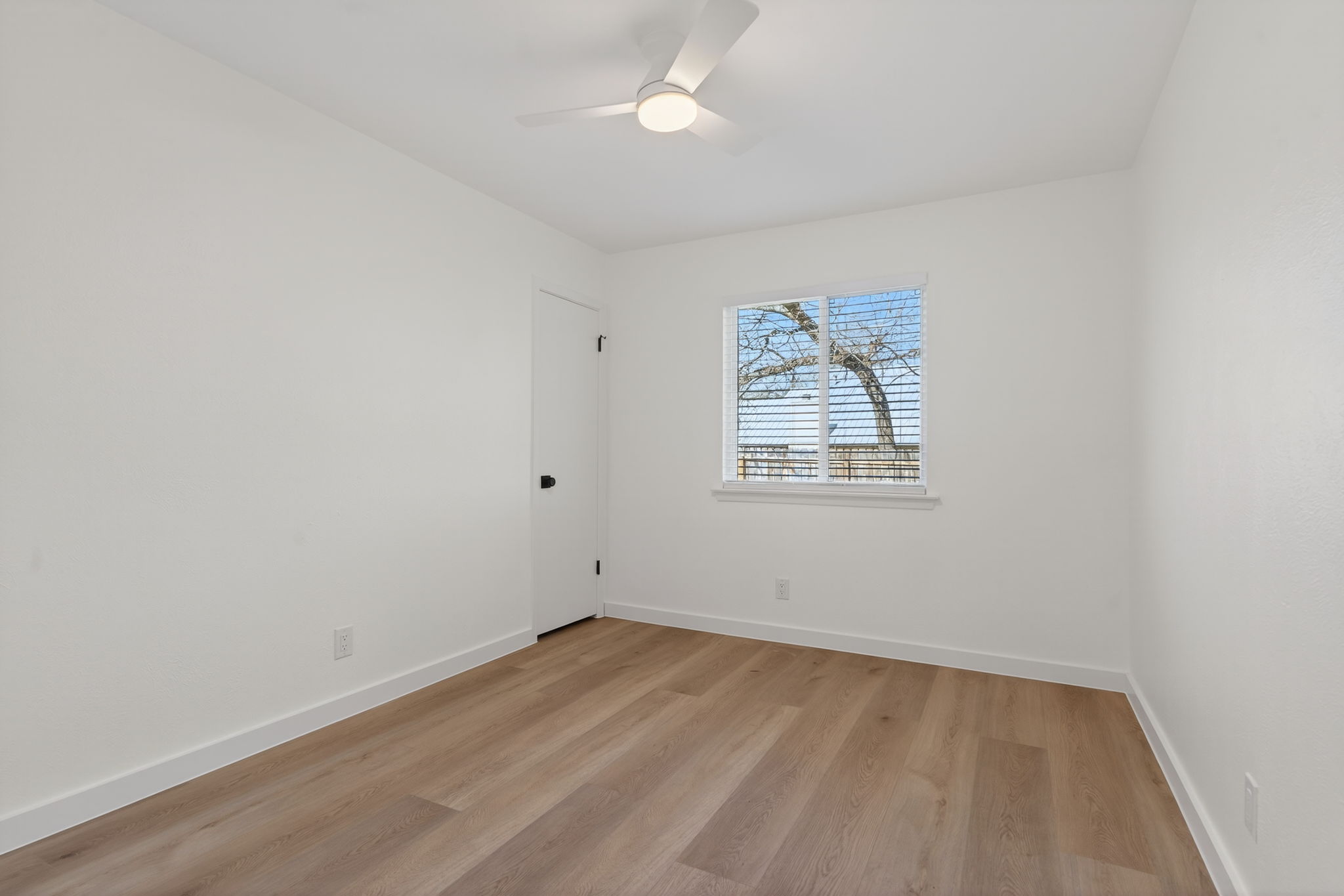 8400 Seminary Ridge Drive Austin, TX 78745 - Photo 16 of 37 Empty room featuring light wood finished floors and a ceiling fan