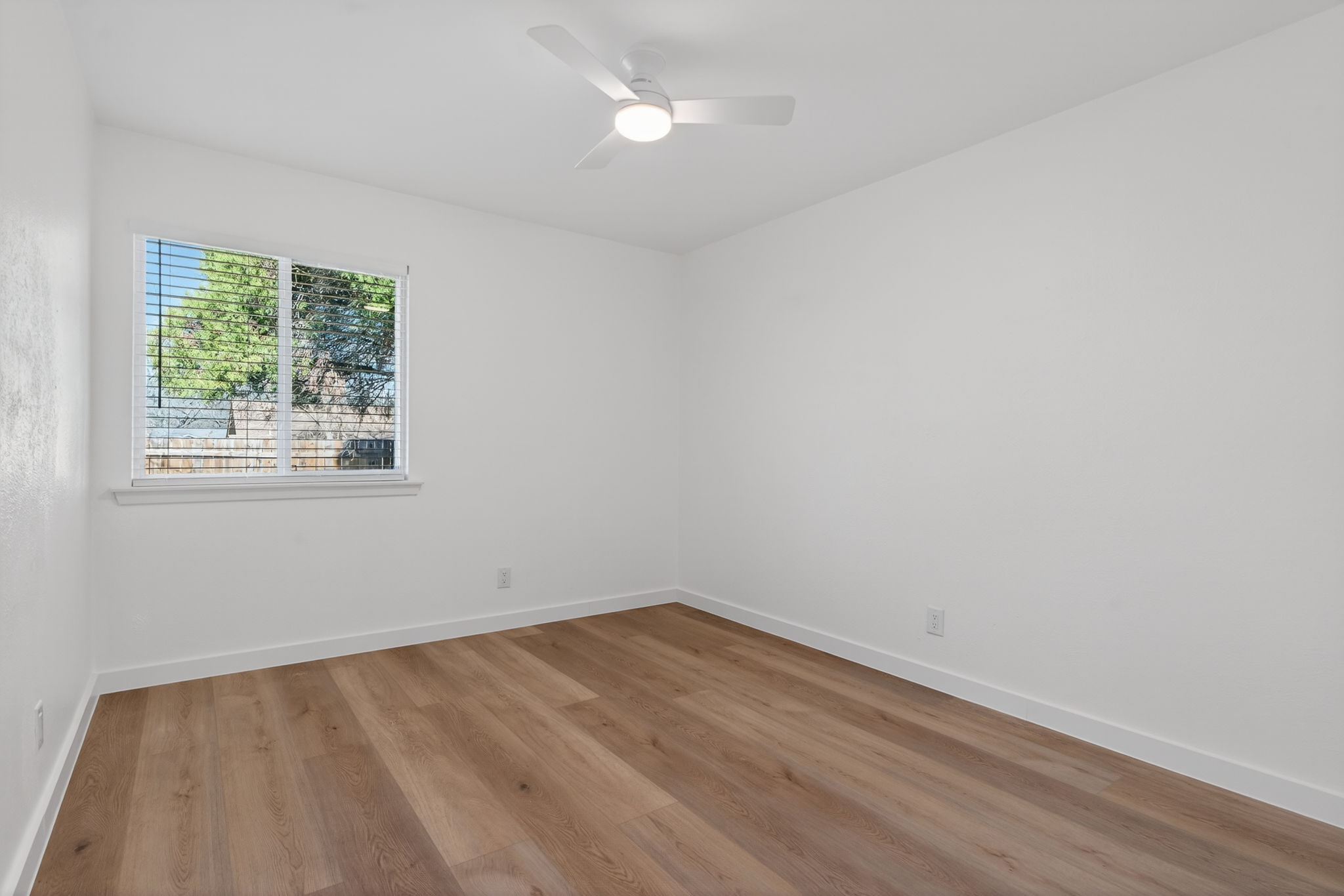 8400 Seminary Ridge Drive Austin, TX 78745 - Photo 17 of 37 Spare room with light wood-style flooring and a ceiling fan