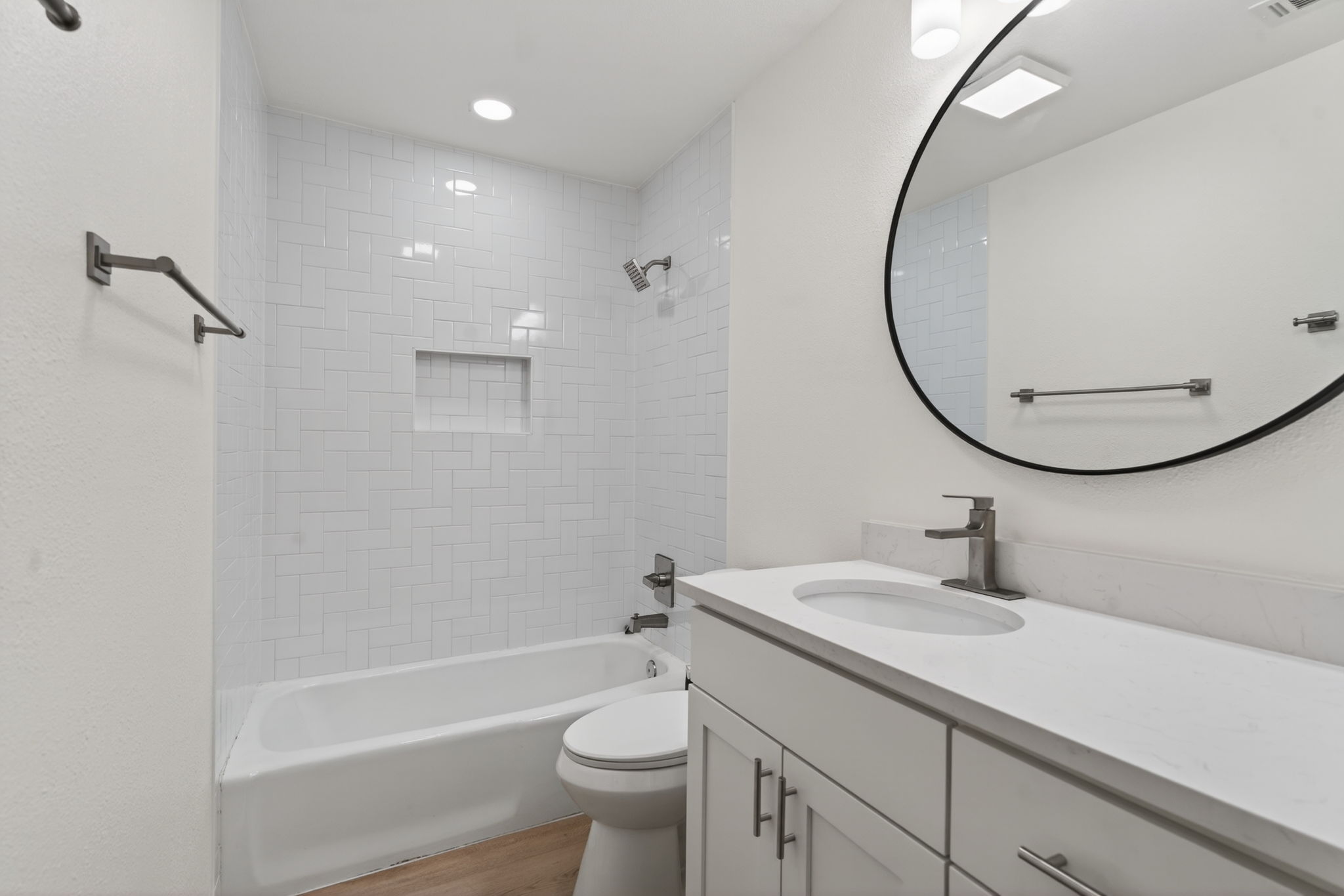 8400 Seminary Ridge Drive Austin, TX 78745 - Photo 18 of 37 Bathroom with vanity, bathing tub / shower combination, light wood-type flooring, and recessed lighting