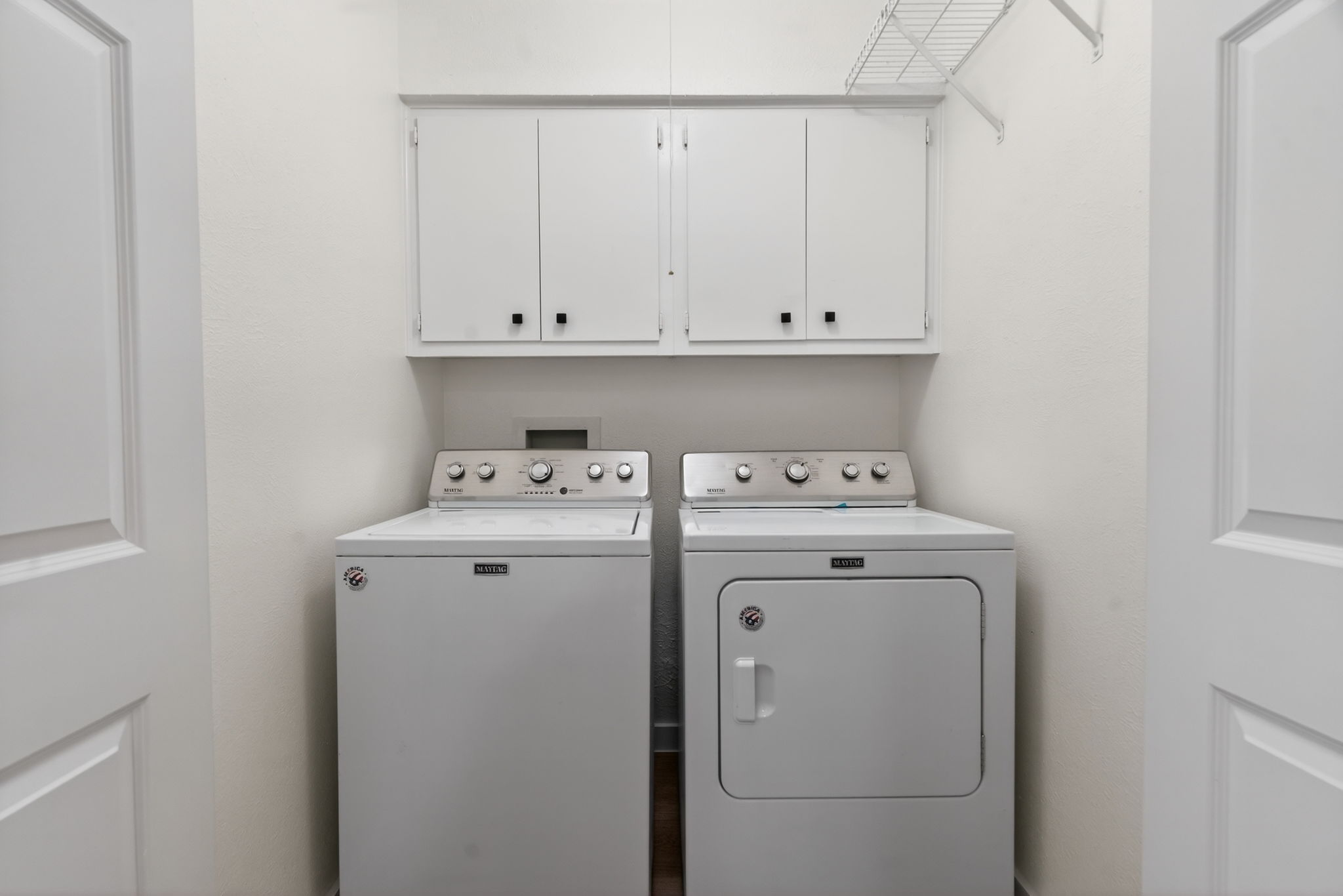 8400 Seminary Ridge Drive Austin, TX 78745 - Photo 20 of 37 Laundry room featuring washer and clothes dryer and cabinet space