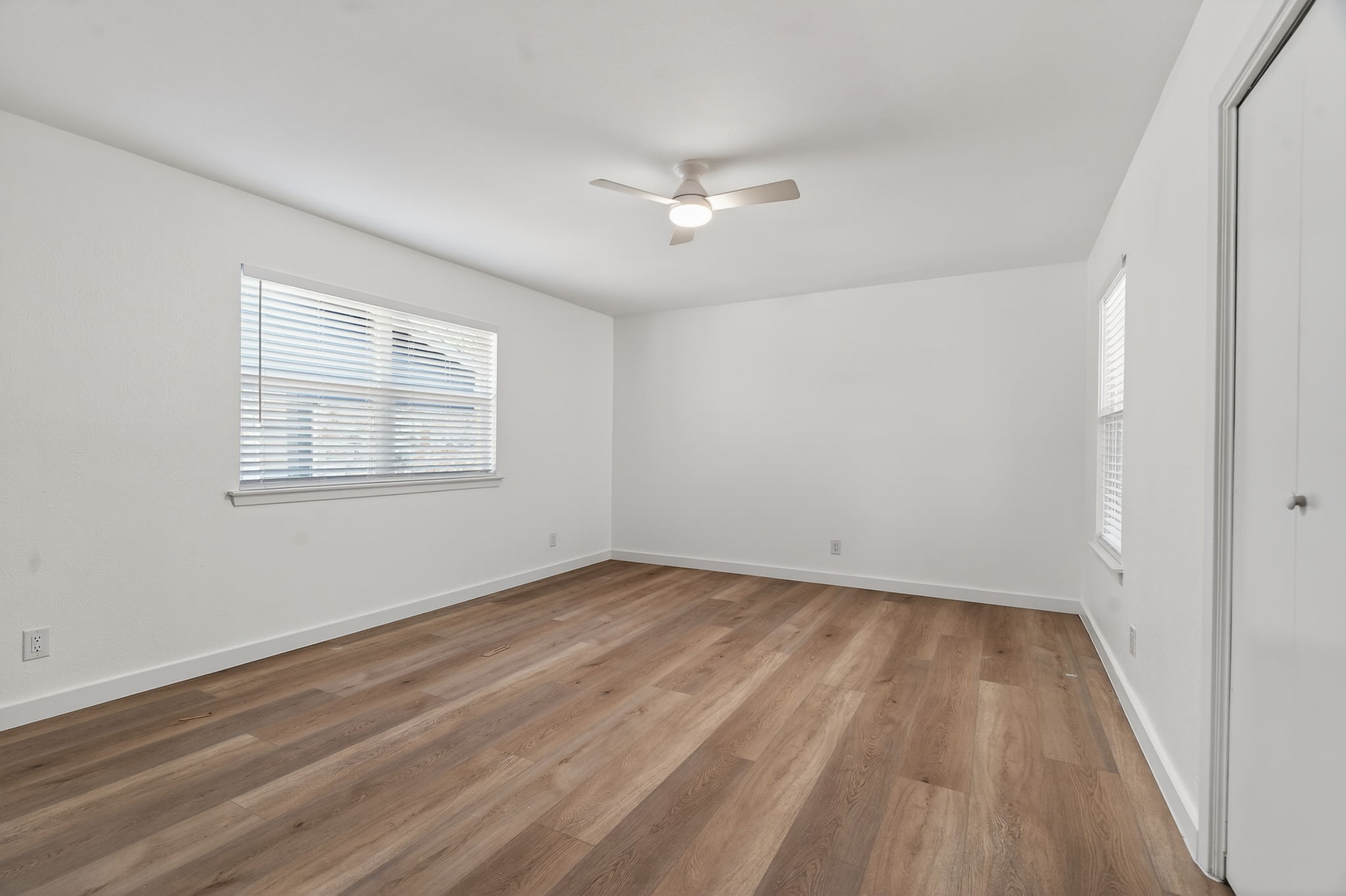 8400 Seminary Ridge Drive Austin, TX 78745 - Photo 22 of 37 Unfurnished bedroom with a closet, ceiling fan, and wood finished floors