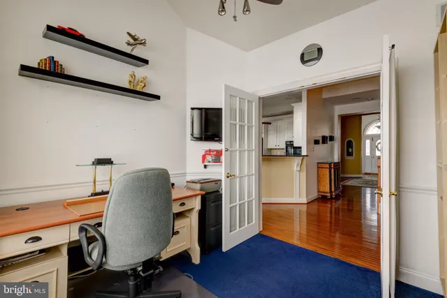 a workspace with furniture and wooden floor