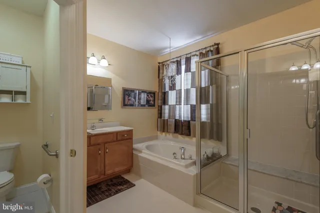 a bathroom with a tub and shower