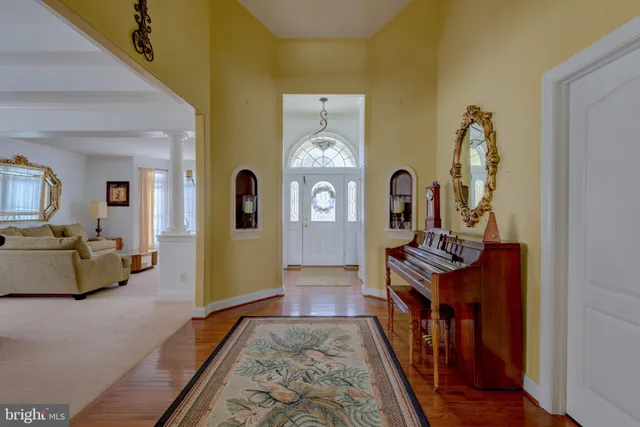 a view of living room with furniture and wooden floor