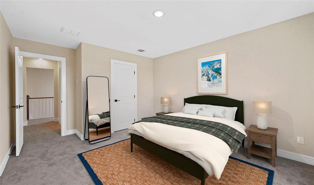 1527 Buckthorn Road Fate, TX 75087 - Photo 21 of 36 a bedroom with a bed a rug and potted plant