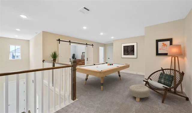 a bathroom with a double vanity sink a mirror and a shower