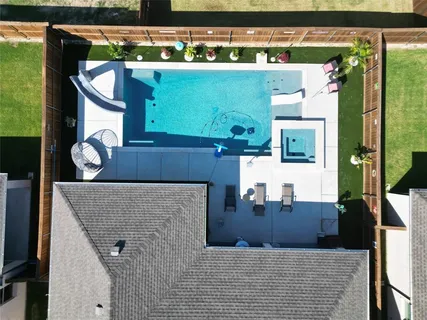 a view of living room kitchen with stainless steel appliances kitchen island wooden floor and living room view