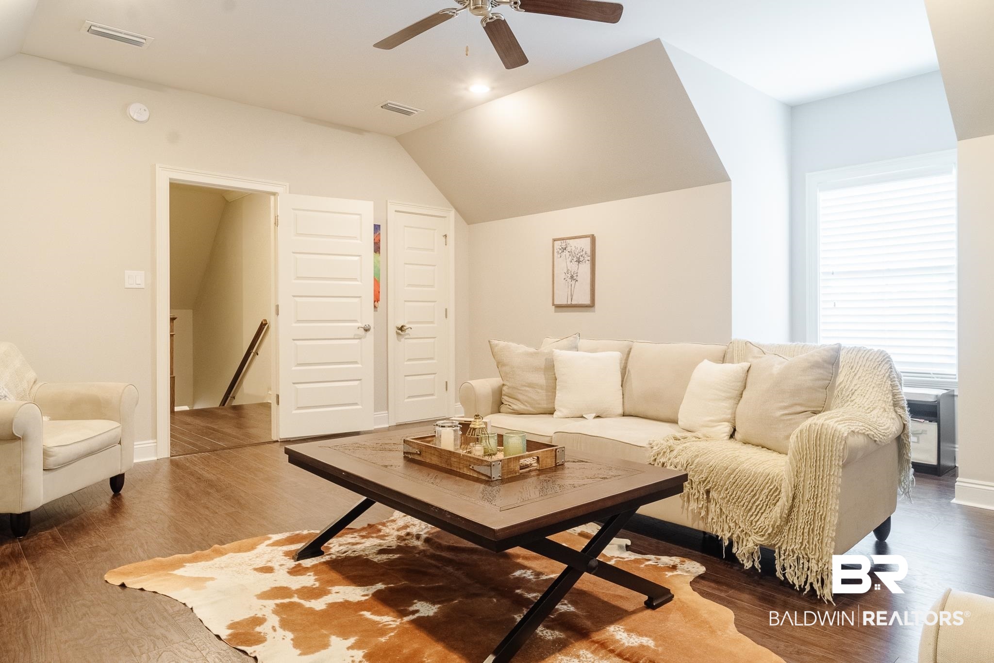 7235 Raleigh Way Mobile, AL 36695 - Photo 29 of 52 Living room with a ceiling fan, wood finished floors, lofted ceiling, and visible vents