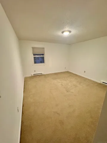 an empty room with a hallway