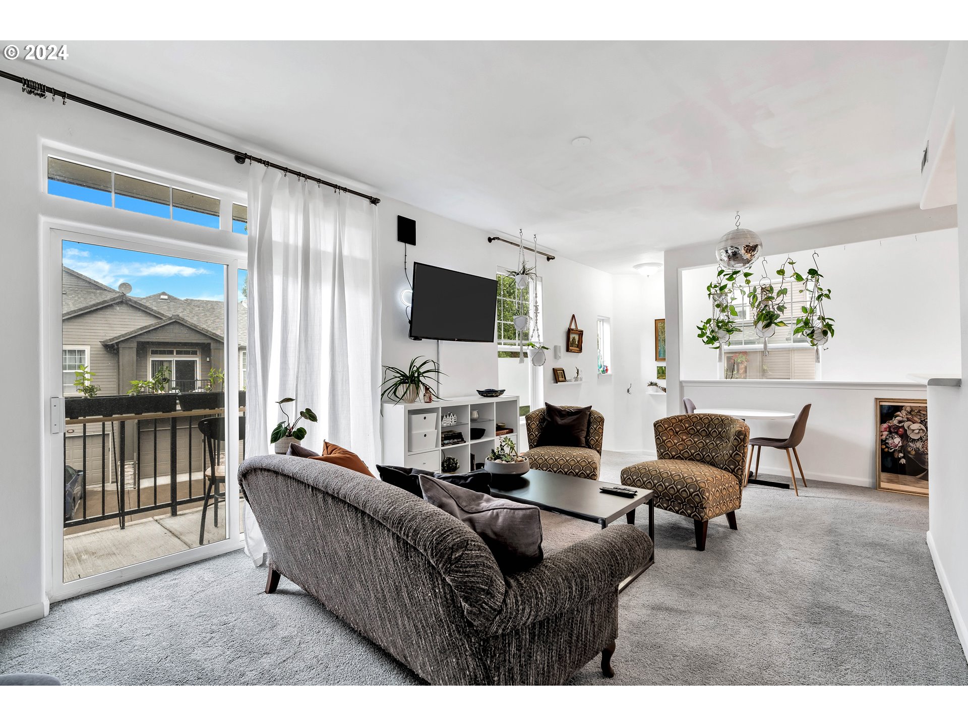 925 Springtree Lane West Linn, OR 97068 - Photo 9 of 24 a living room with furniture and a flat screen tv