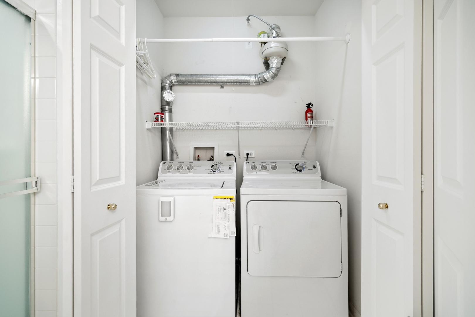 820 Weidner Road, Unit 304 Buffalo Grove, IL 60089 - Photo 15 of 18 a utility room with dryer and washer