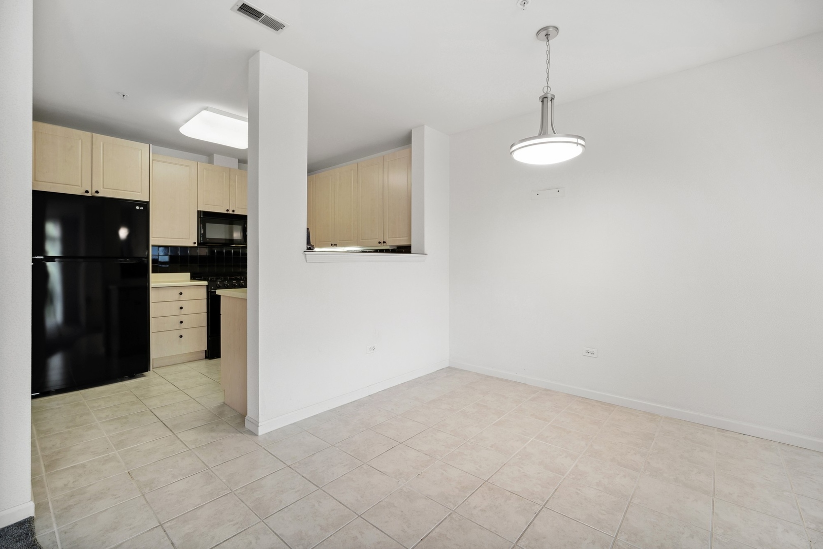 820 Weidner Road, Unit 304 Buffalo Grove, IL 60089 - Photo 6 of 18 a kitchen with stainless steel appliances a refrigerator and microwave