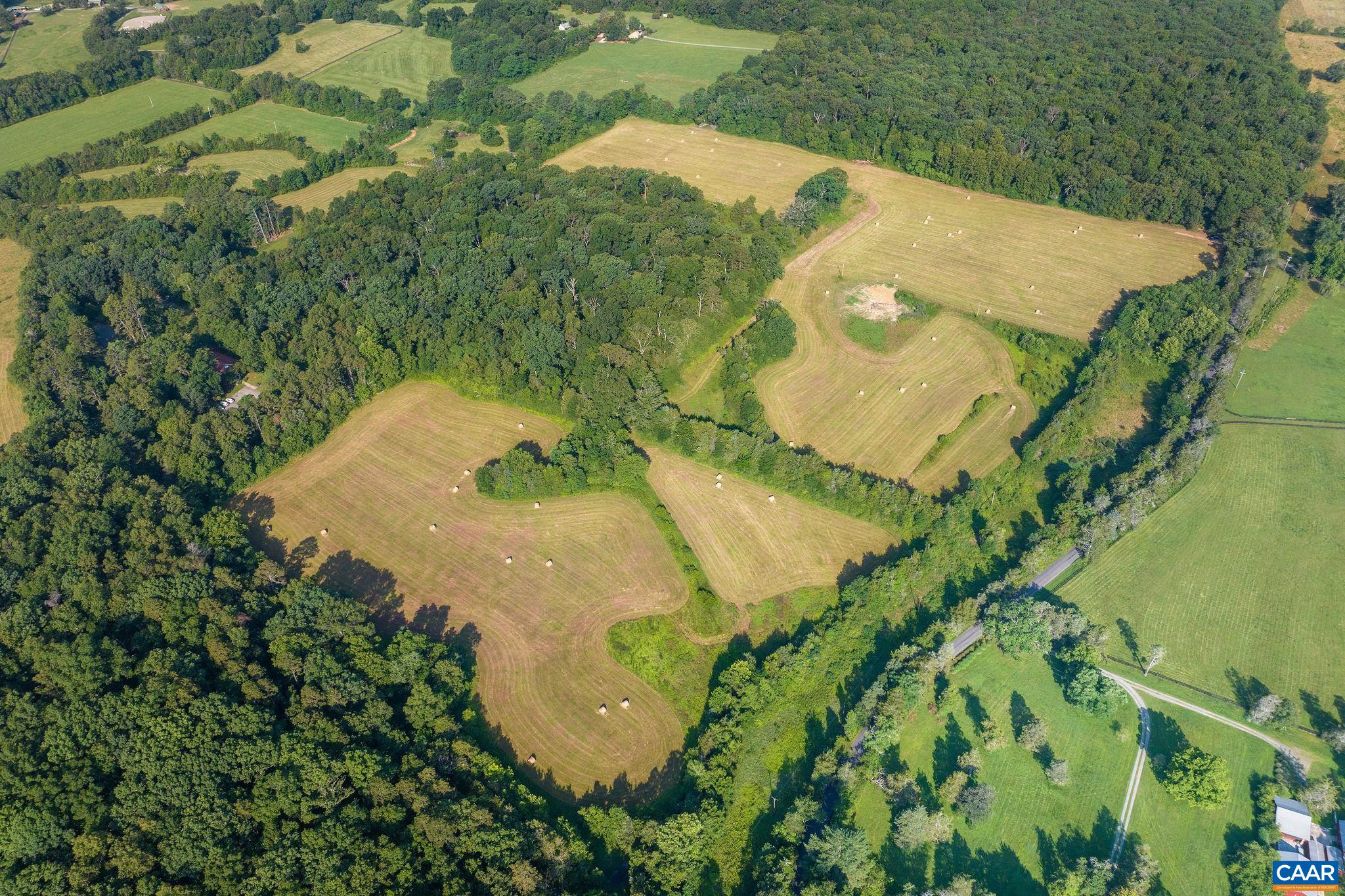 76.99-acres Coles Rolling Road Scottsville, VA 24590 - Photo 8 of 33 an aerial view of a house