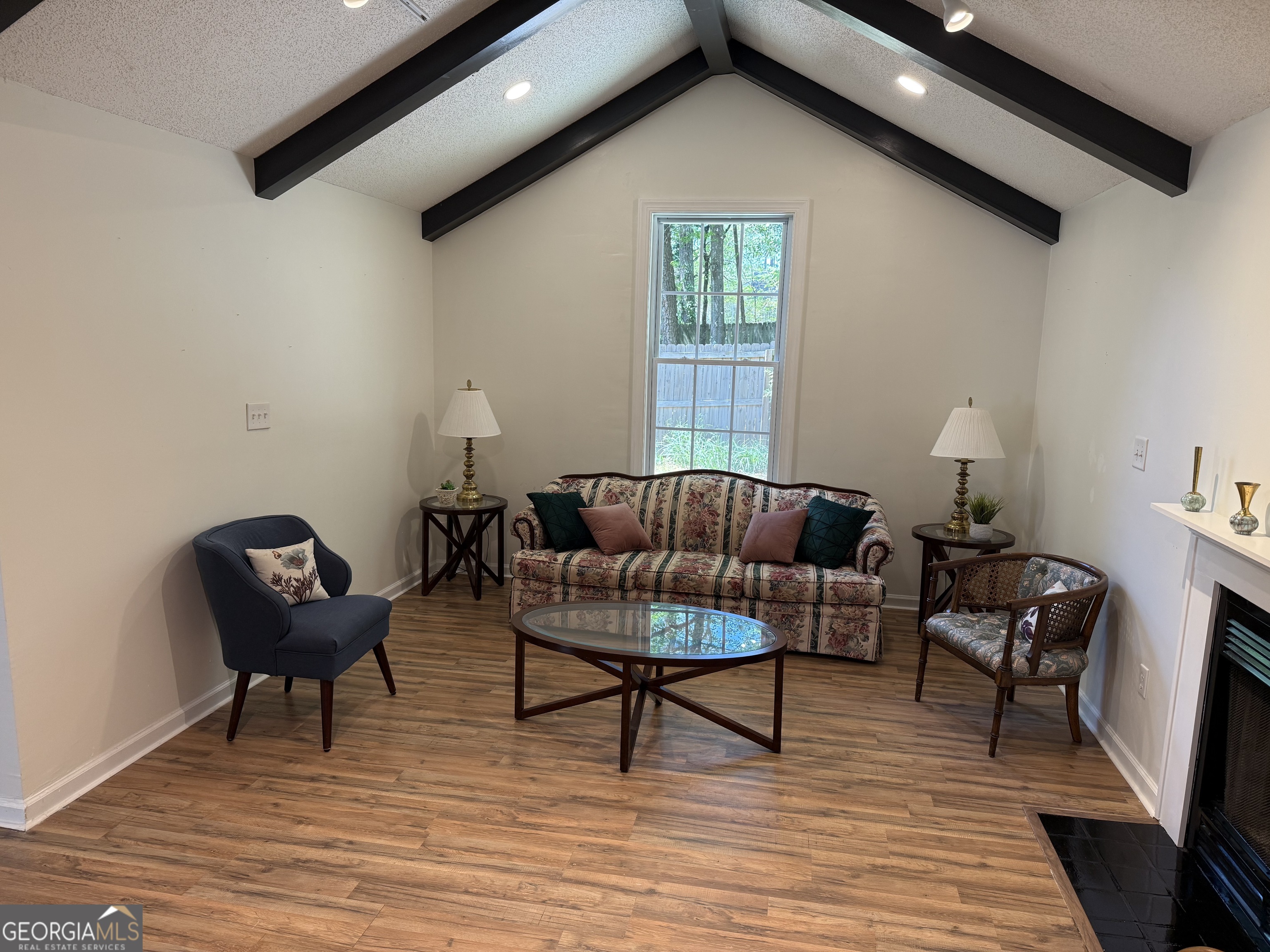 109 Layla Court Athens, GA 30605 - Photo 11 of 32 a living room with furniture and a potted plant