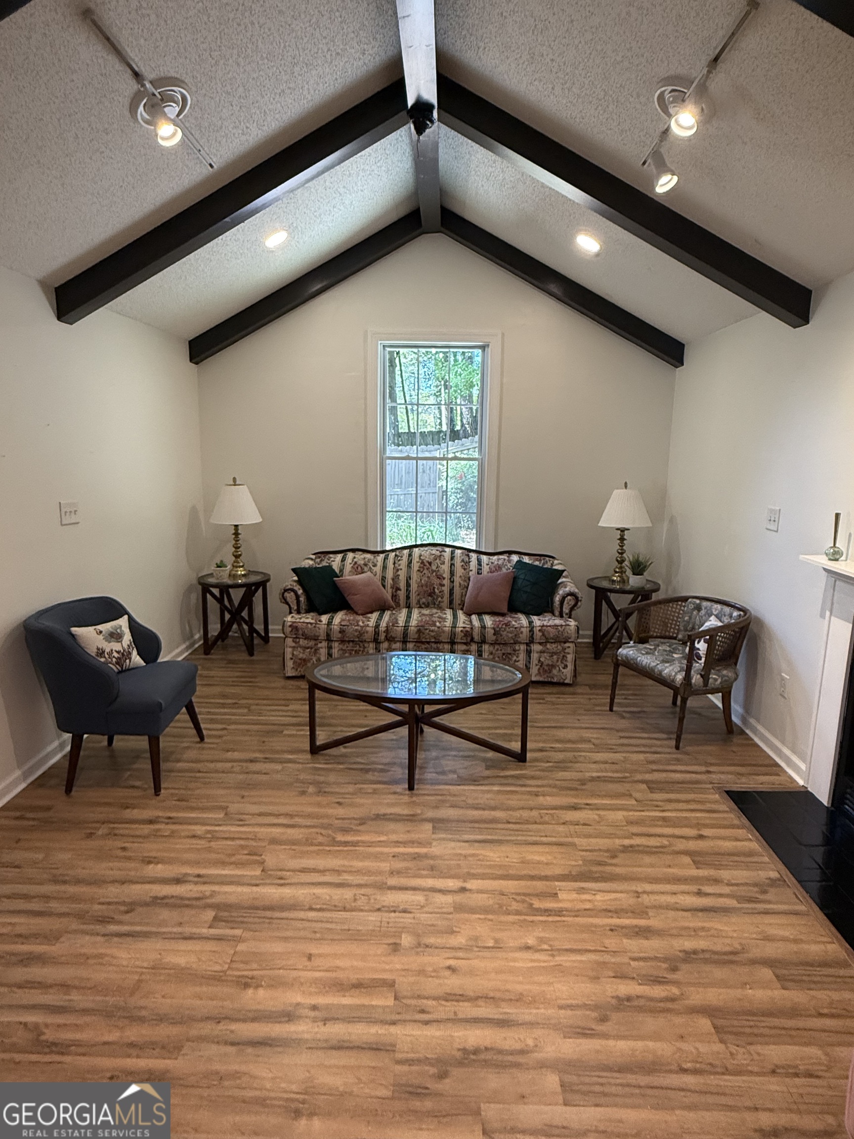 109 Layla Court Athens, GA 30605 - Photo 12 of 32 a living room with furniture and a wooden floor