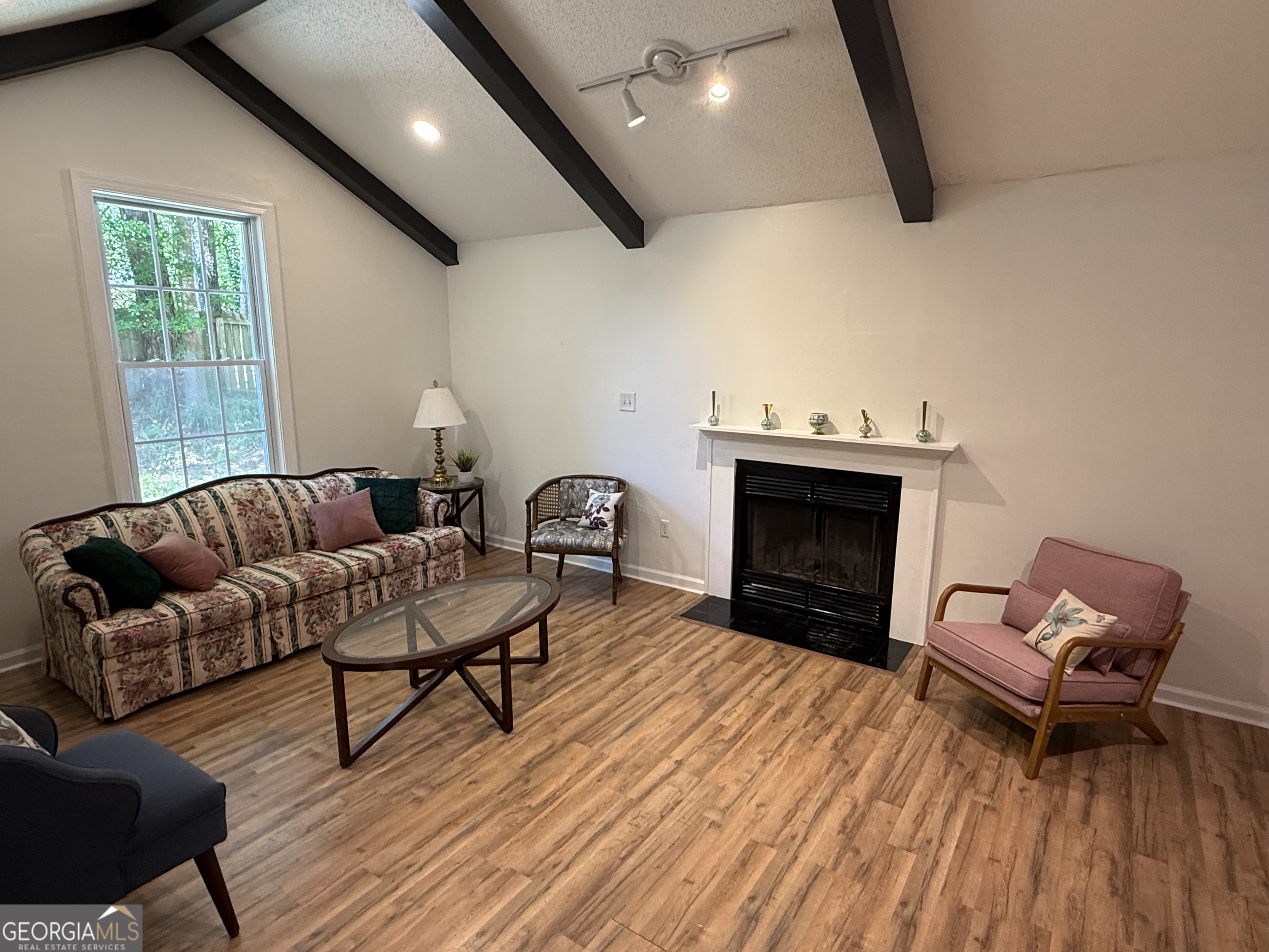 109 Layla Court Athens, GA 30605 - Photo 13 of 32 a living room with furniture and a fireplace