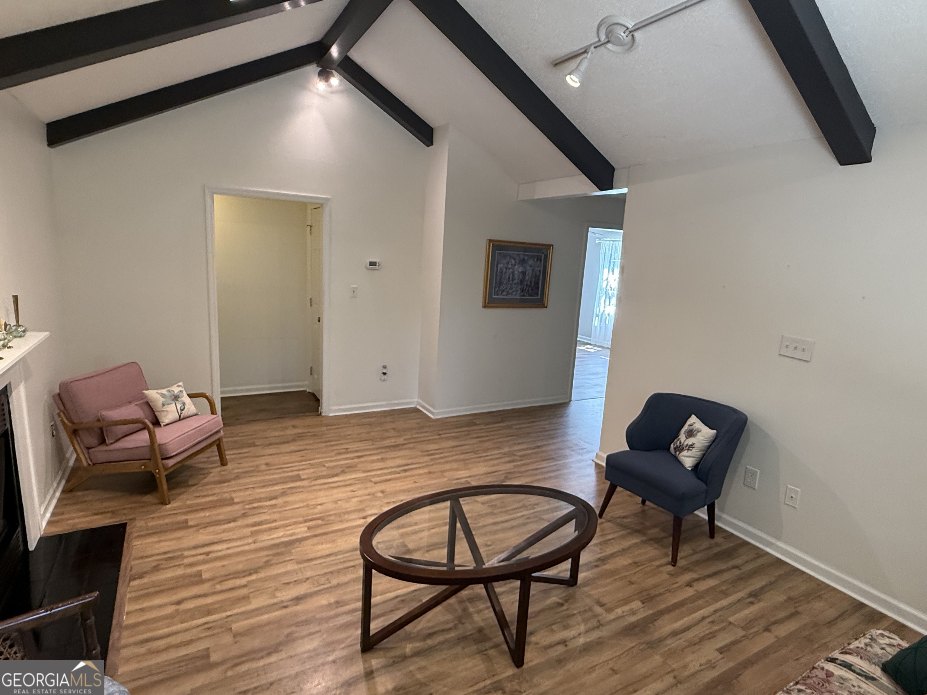 109 Layla Court Athens, GA 30605 - Photo 15 of 32 a view of a workspace with furniture and wooden floor