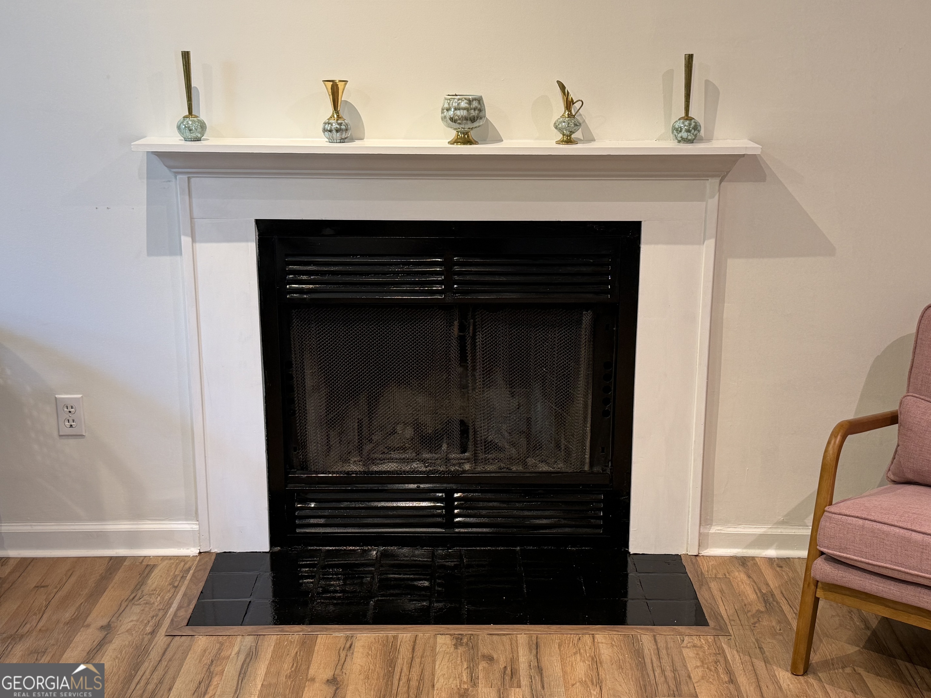 109 Layla Court Athens, GA 30605 - Photo 17 of 32 a living room with a fireplace and wooden floor
