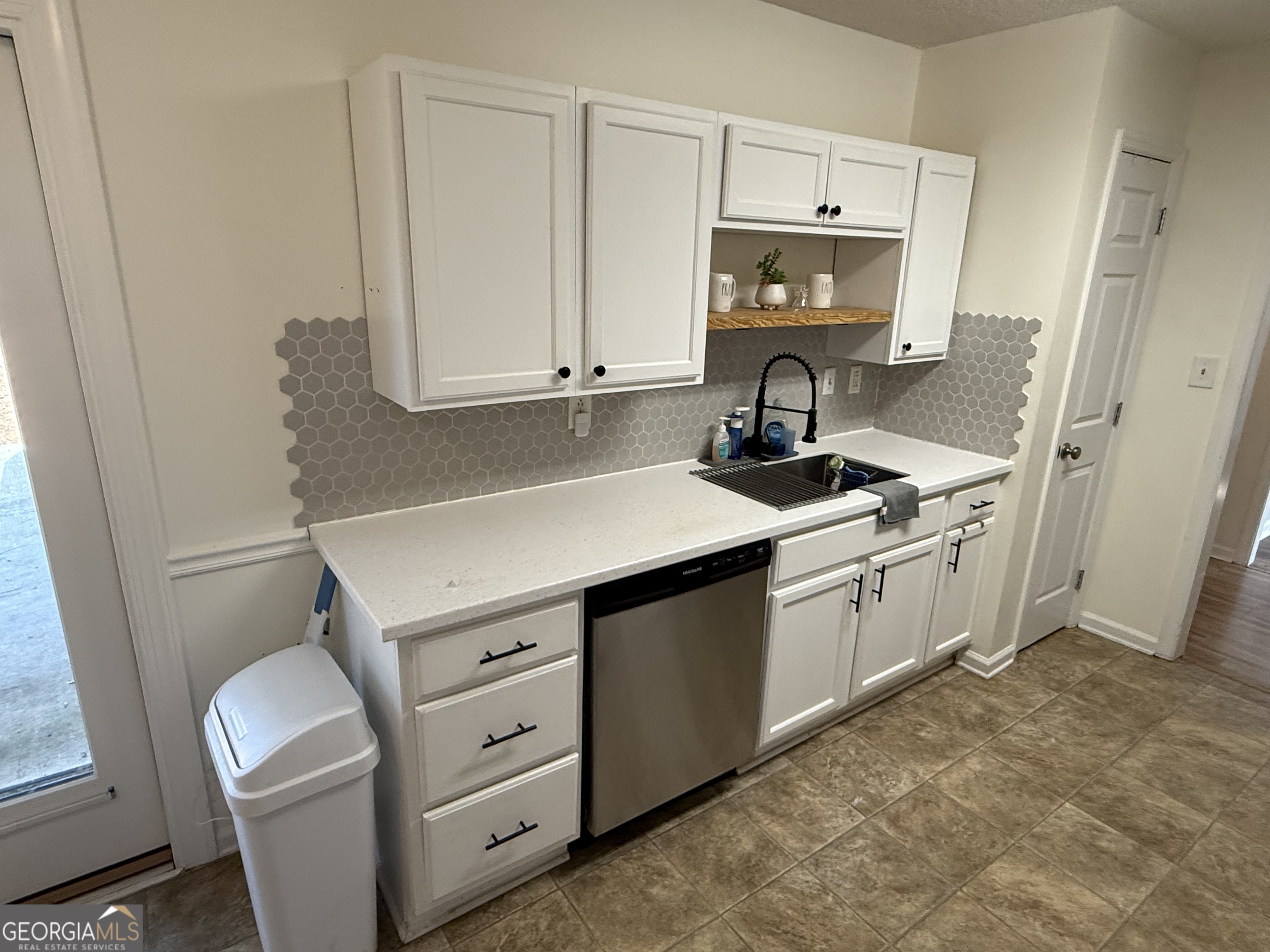 109 Layla Court Athens, GA 30605 - Photo 21 of 32 a kitchen with cabinets appliances and a window