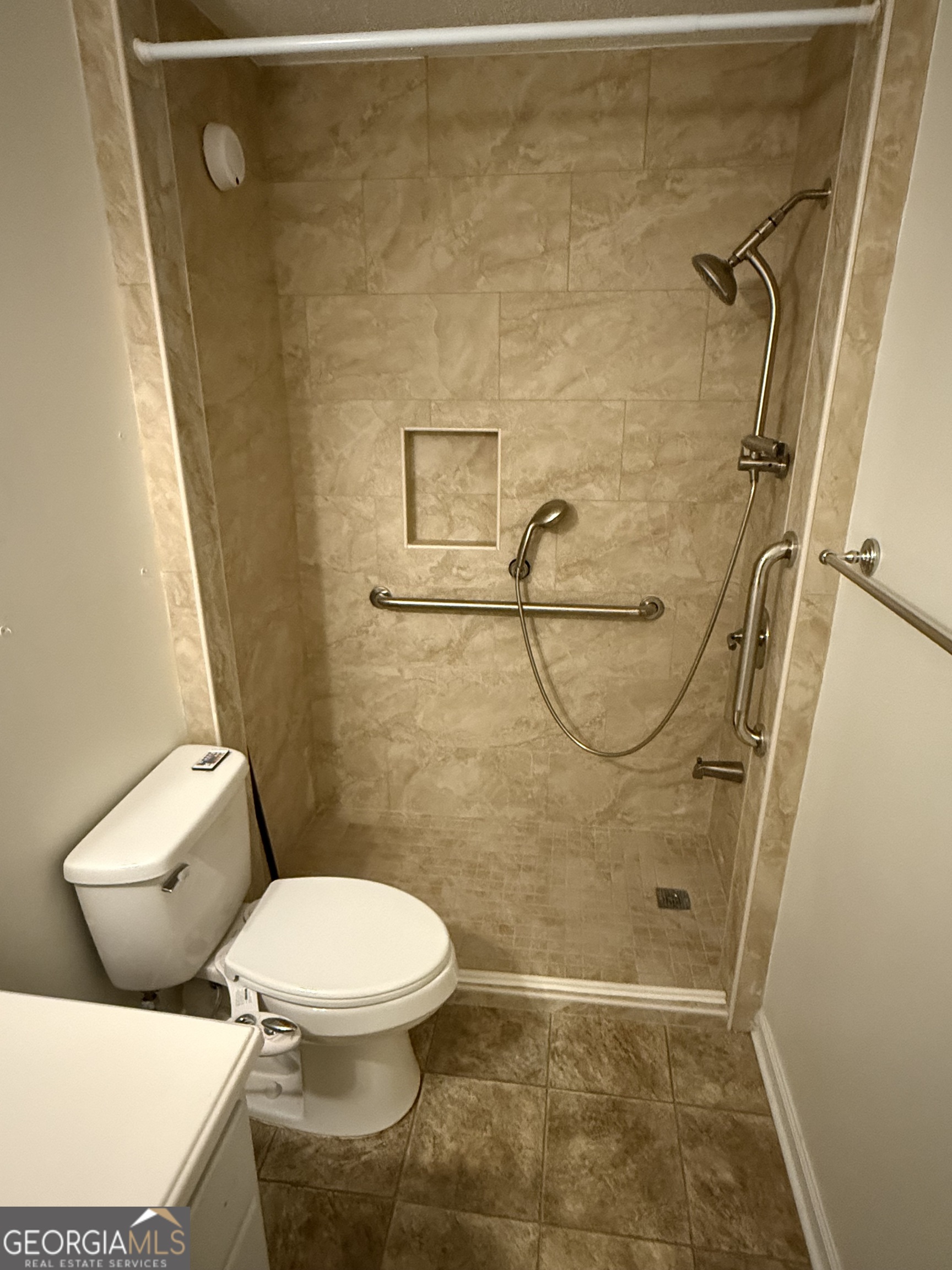109 Layla Court Athens, GA 30605 - Photo 25 of 32 a white toilet sitting next to a shower and a sink