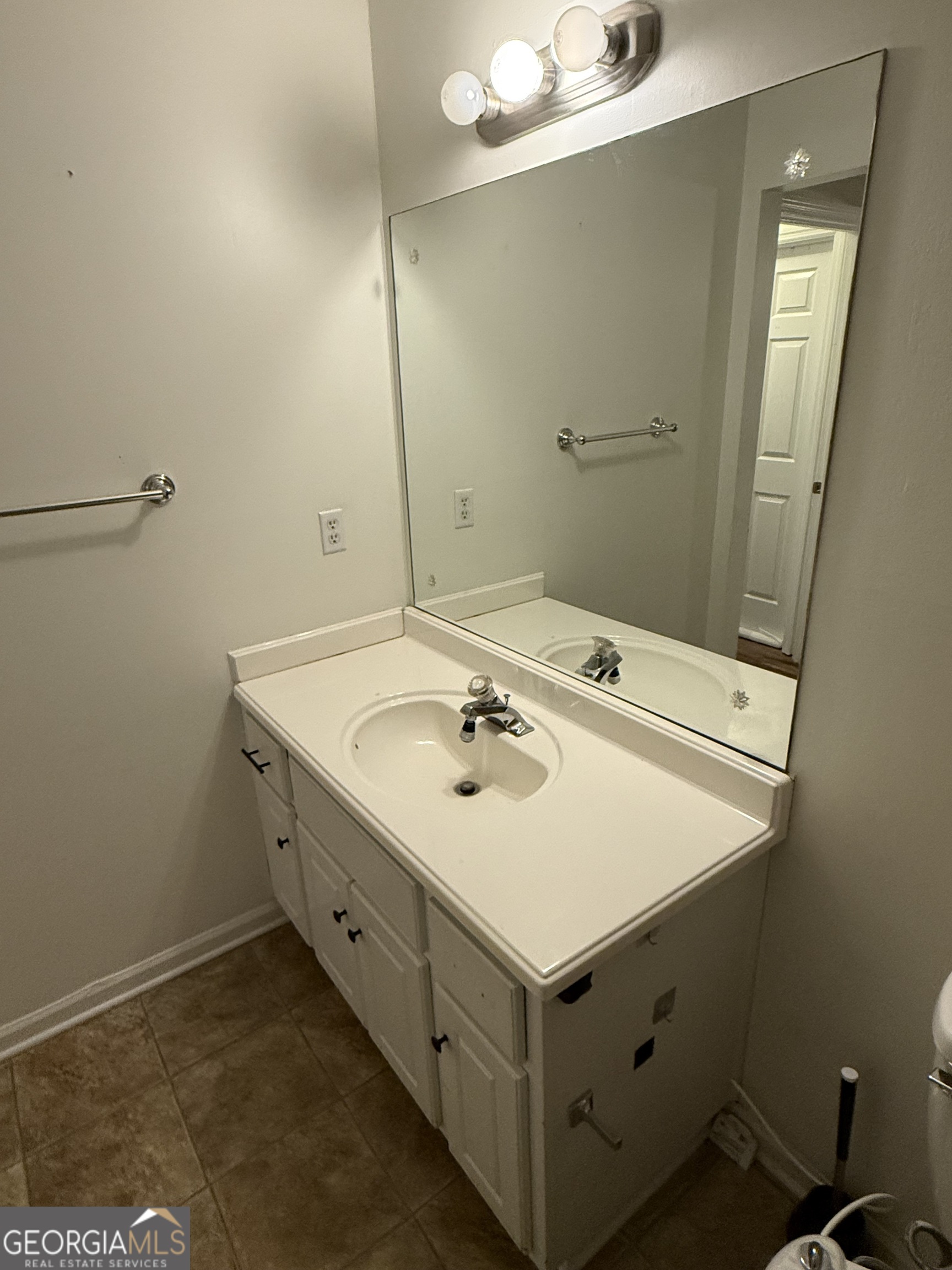 109 Layla Court Athens, GA 30605 - Photo 26 of 32 a bathroom with a sink and a mirror