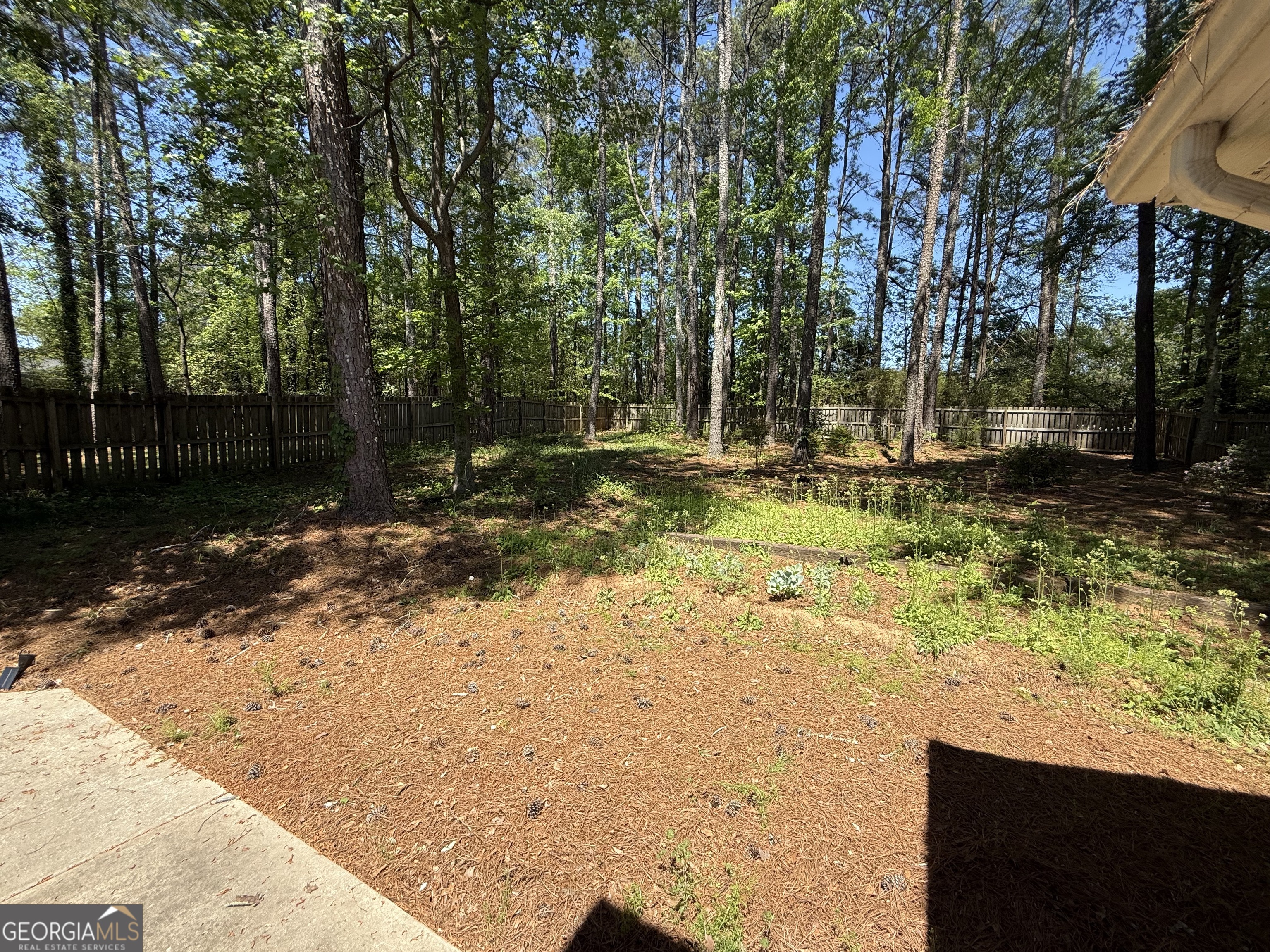 109 Layla Court Athens, GA 30605 - Photo 31 of 32 a backyard of a house with trees and outdoor seating