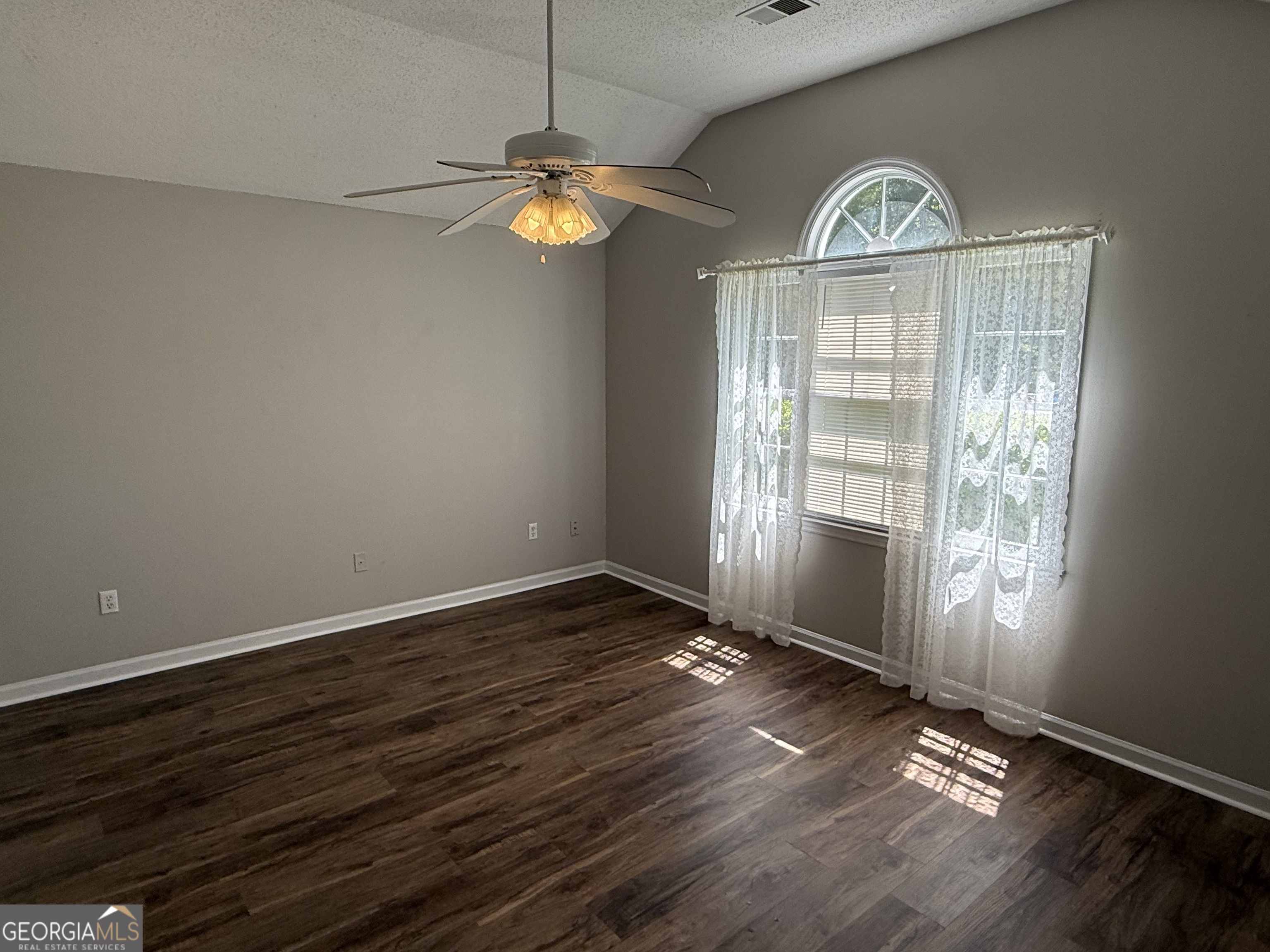 109 Layla Court Athens, GA 30605 - Photo 7 of 32 an empty room with wooden floor and windows