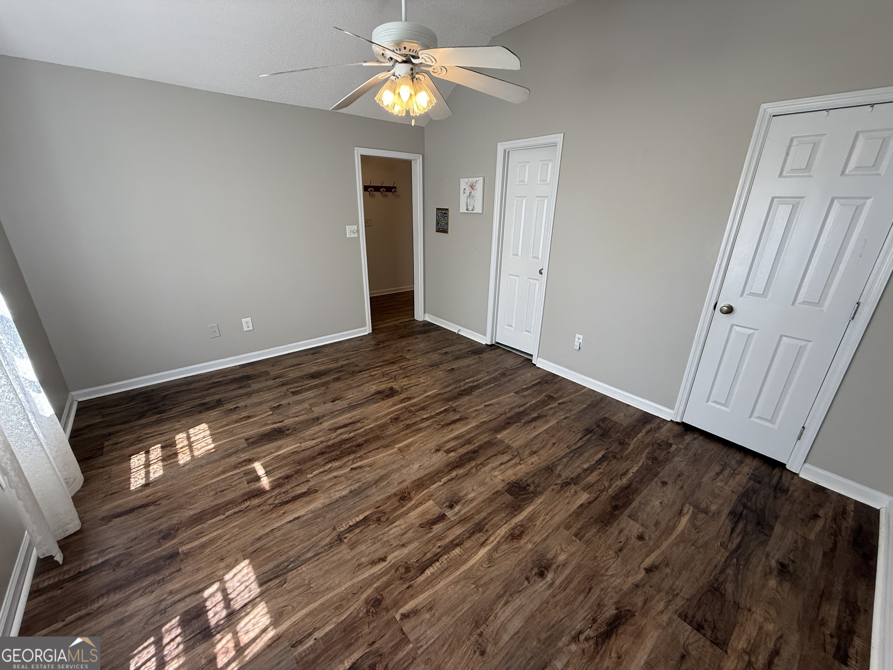 109 Layla Court Athens, GA 30605 - Photo 8 of 32 a view of empty room with wooden floor and fan