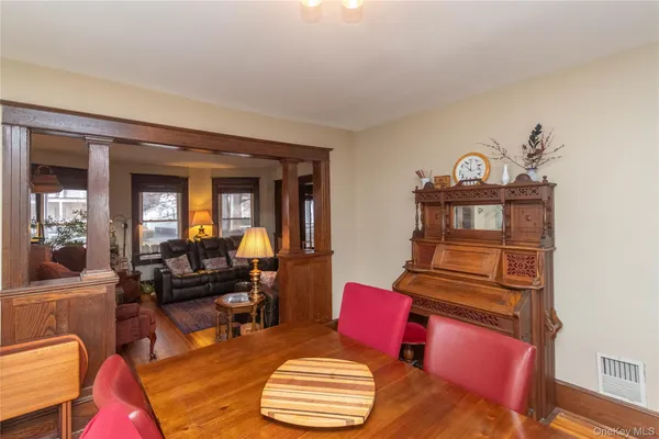 a kitchen with a sink window and cabinets